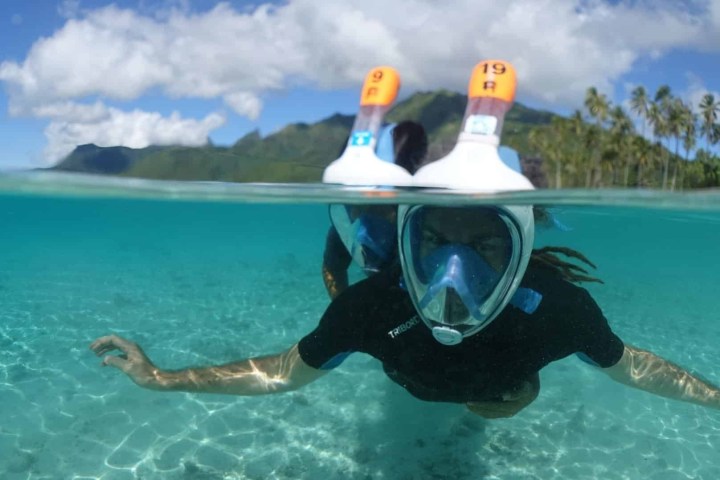 a man swimming in a pool of water